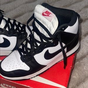 Nike Black and White High-Top Sneakers with Red Logo